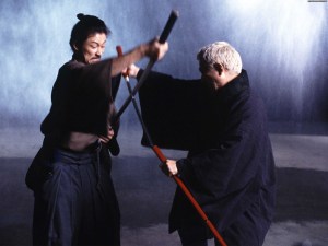 Hattori (Tadanobu Asano) & Zatoichi (Takeshi Kitano) engage in battle.